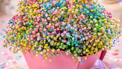 Colourful baby breath flower arrangement in gift box, vibrant bouquet for newborn celebration and joyful gifting