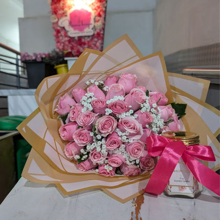 Charming pink roses with scented candle