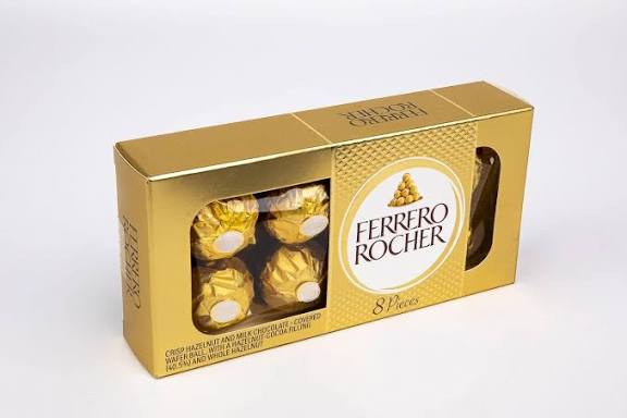 Ferrero Rocher 8-piece chocolate box with gold packaging and visible hazelnut chocolates inside