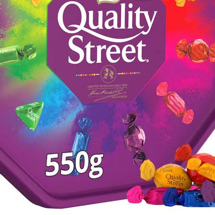 Quality Street assorted chocolates box 550g with colourful wrapped sweets on purple packaging