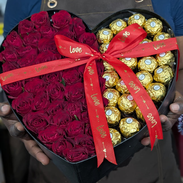 Half Sweet Half Heart gift with red roses and Ferrero chocolates in a heart-shaped box with ribbon.