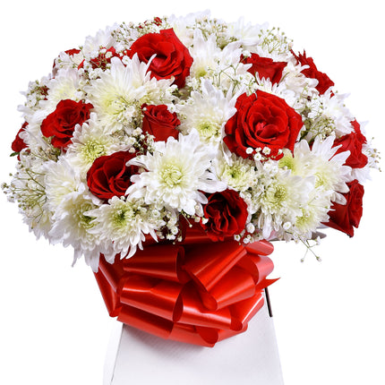 The Amor bouquet with red roses, white chrysanthemums, and baby’s breath in a box with red ribbon.
